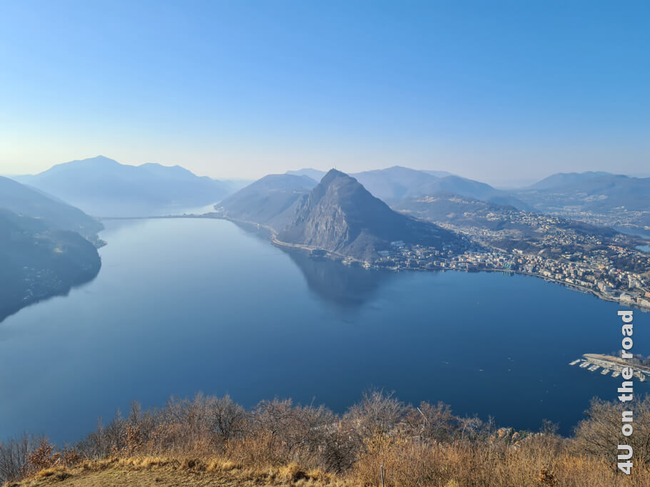 Frühaufsteher werden mit einem solchen Blick über den Golf von Lugano belohnt. Gegenüber ragt aus all den Bergen markant der San Salvatore heraus.